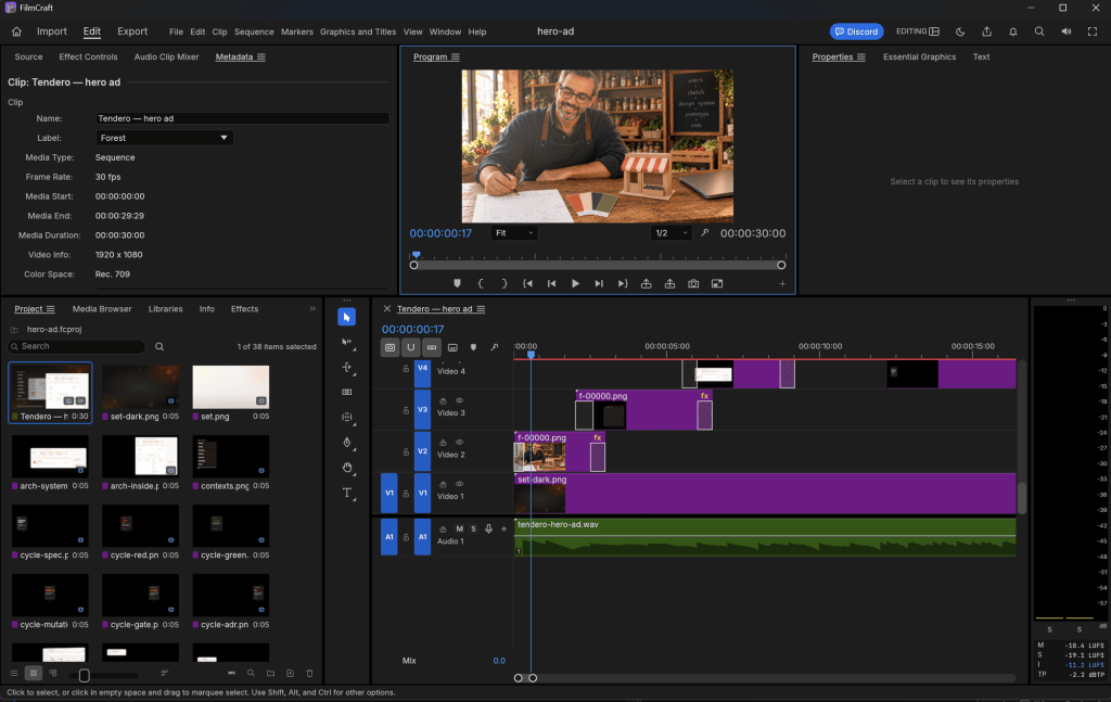 The hero ad open in FilmCraft: the project's 38 items, the timeline with the shopkeeper's moving plate on V2 over the dark set on V1, the score on A1, and the loudness meter